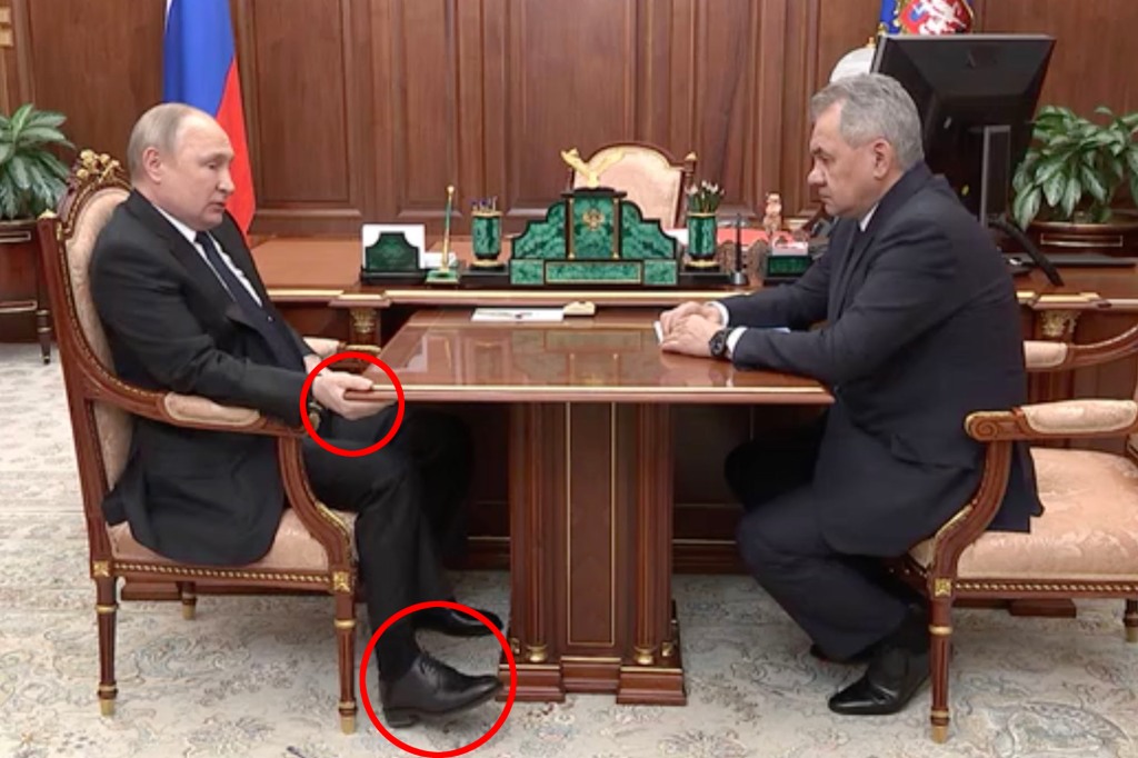 Władimir Putin jest widziany opuchniętym trzymającym stół, leżącym na krześle podczas telewizyjnego spotkania ze swoim ministrem obrony wśród plotek, że rosyjski siłacz walczy z rakiem.