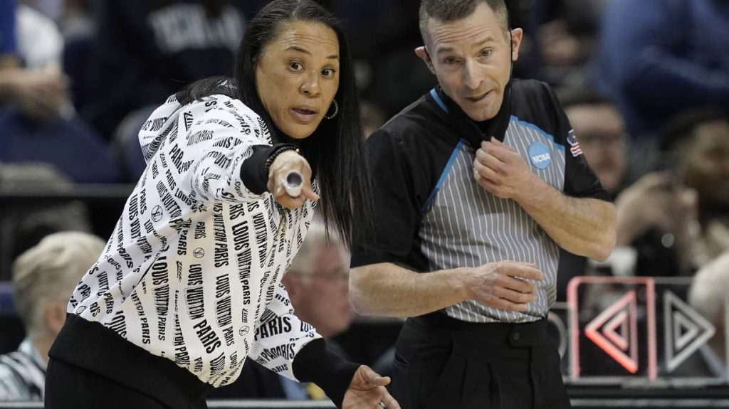 In this March 27, 2022 file photo, South Carolina coach Dawn Staley speaks with an official during the first half of a college basketball game against Creighton in the Elite 8 round of the NCAA tournament in Greensboro, N.C.